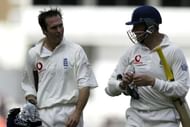 Michael Vaughan and Marcus Trescothick walk off for the lunch break